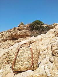 Rock formations against clear blue sky