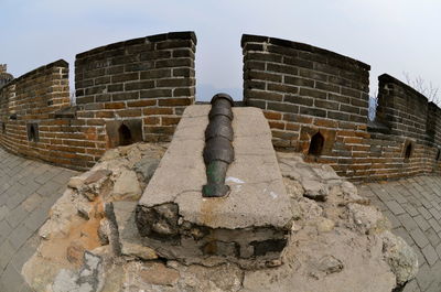 Low angle view of old ruin building against sky