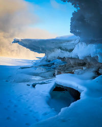 Scenic view of snow covered landscape against sky