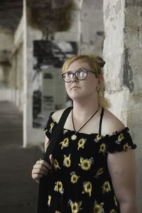 Portrait of young woman standing outdoors