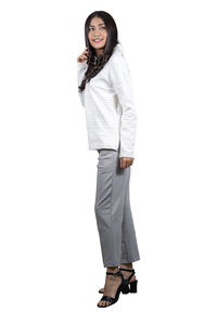 Portrait of a smiling young woman against white background