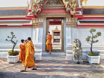Monks walking outside temple