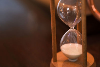 Close-up of illuminated light bulb on table