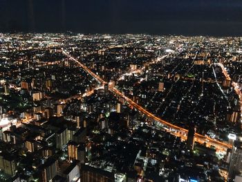 High angle view of illuminated cityscape at night