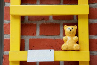 Close-up of toys against wall