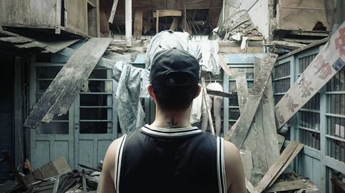 Facing the destroyed building .