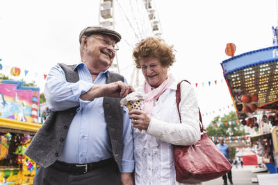 Senior couple having fun together on fair