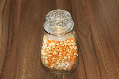 High angle view of glass jar on table