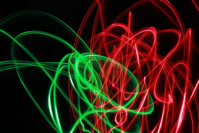 Close-up of light trails against black background