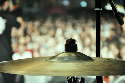 Cymbal on the stage - blurred crowd in the background