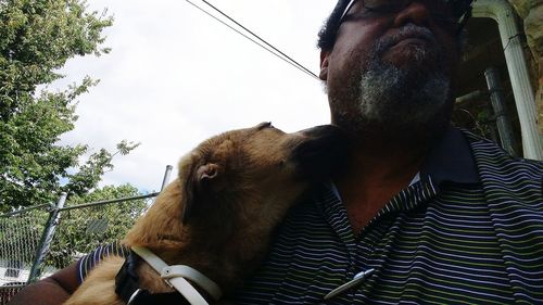 Man with horse against sky