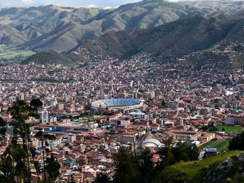 High angle view of townscape against mountains