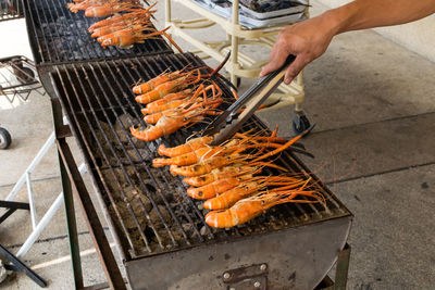 High angle view of meat cooking on barbecue grill