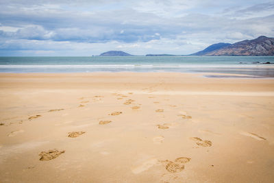 Scenic view of beach against sky