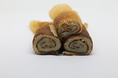 Close-up of cake against white background