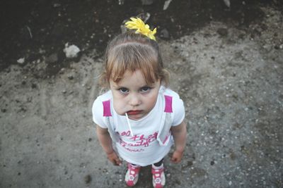 High angle portrait of cute girl with lollipop