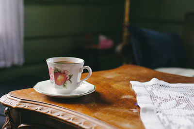 Close-up of coffee cup on table