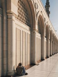 Rear view of colonnade and building in city