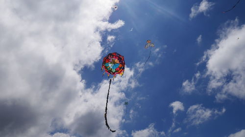 Low angle view of kite flying against sky