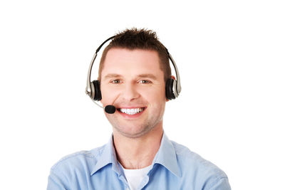 Portrait of customer service representative standing against white background