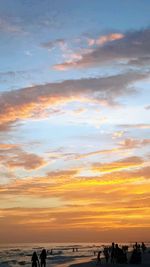 Scenic view of beach against sky during sunset