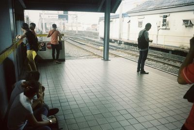 People on railroad station platform