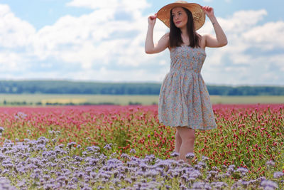 Full length of woman standing on field