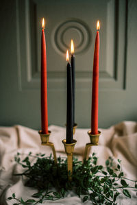 Lit candles on a cloudy day. warm and witchy vibes.