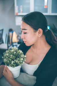 Woman looking at flowers