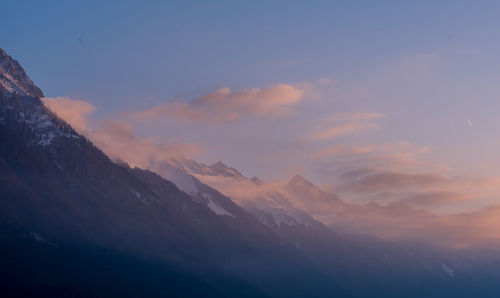 Scenic view of mountains against sky during sunset