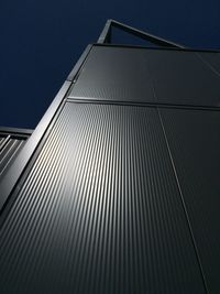 Low angle view of modern building against sky at night