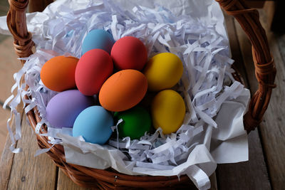 High angle view of eggs in basket on table