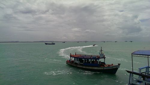 Boats sailing in sea