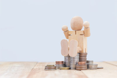 Close-up of stack on table against white background