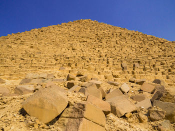 Text on rock in desert against clear sky