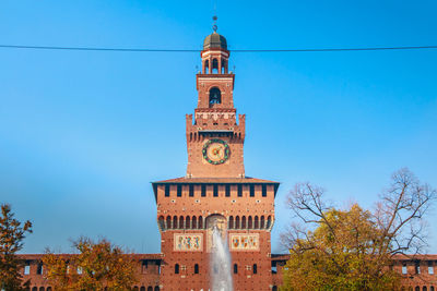 Low angle view of clock tower against sky