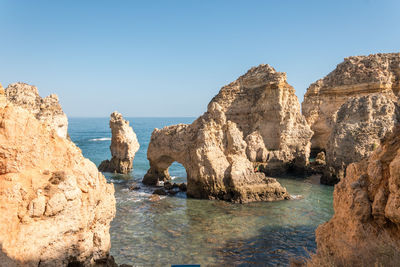 Panoramic view of sea against clear blue sky