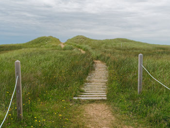 Scenic view of land against sky