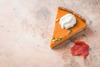 High angle view of cake slice on cutting board