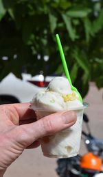 Close-up of hand holding ice cream