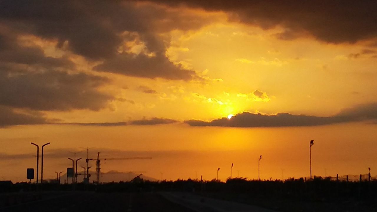 sunset, sky, cloud - sky, orange color, environment, scenics - nature, beauty in nature, fuel and power generation, technology, tranquil scene, silhouette, tranquility, turbine, wind turbine, nature, no people, landscape, sun, environmental conservation, renewable energy, electricity, outdoors, power supply, sustainable resources