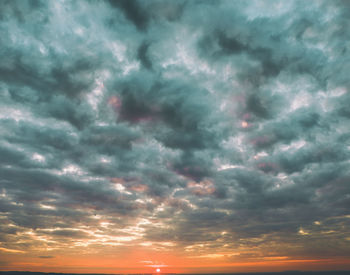 Low angle view of dramatic sky during sunset