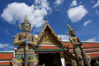 Statue of temple against building