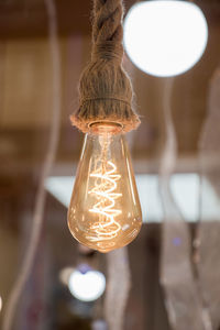 Close-up of illuminated light bulb