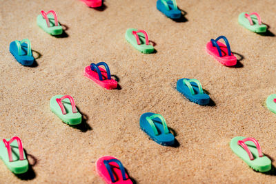 High angle view of toys on sand