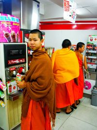 Friends standing at store