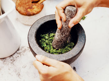 Production of parsley herb salt in a mortar