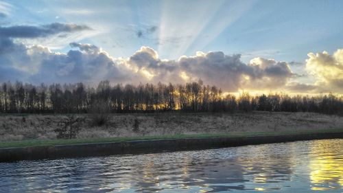 Scenic view of lake against sky during sunset