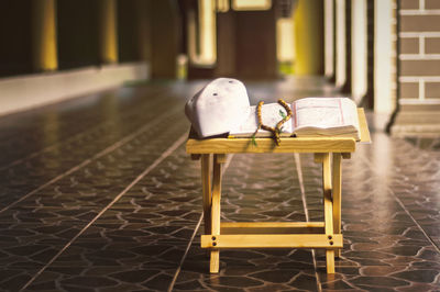 Empty chairs and tables in the tiled floor