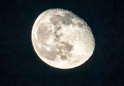 Low angle view of moon against sky at night